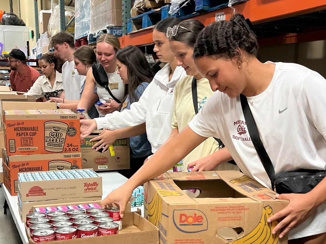 UM_7 food Bank_Volunteer Packing Food-1
